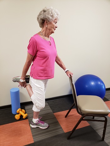 standing quadriceps stetch senior exercise