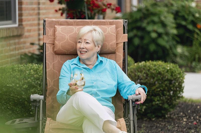 FWE Woman Outside Sipping Drink