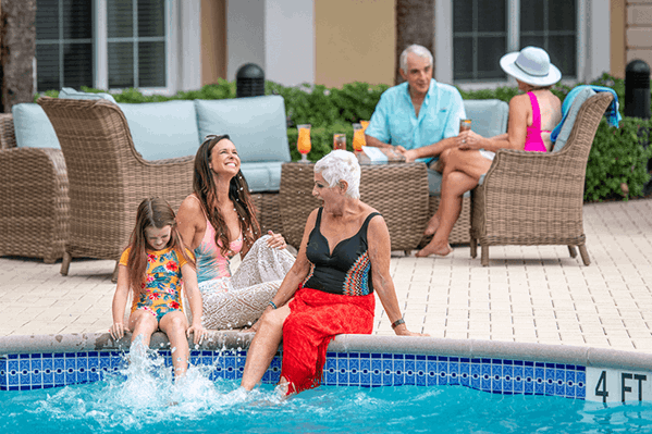 A family playing in a community pool