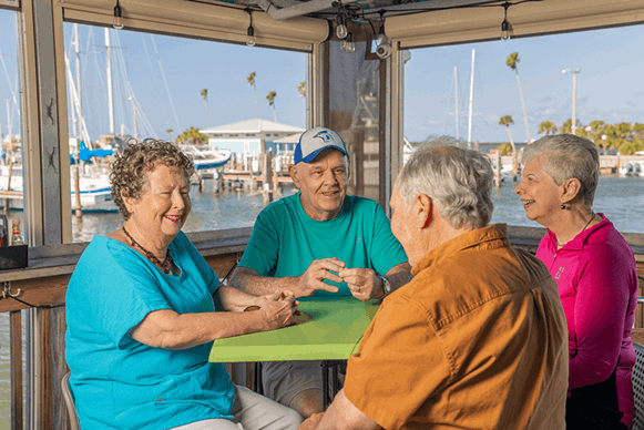 Four friends talking around a table
