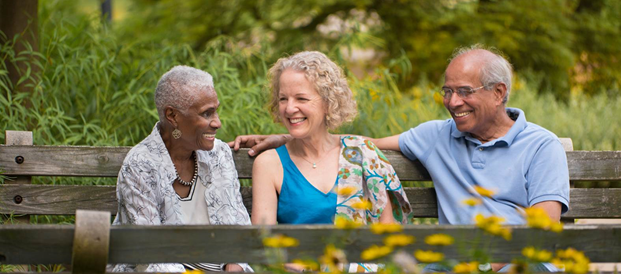 Friends sitting together on a bench