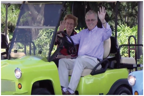 Retirement community residents in a golf cart