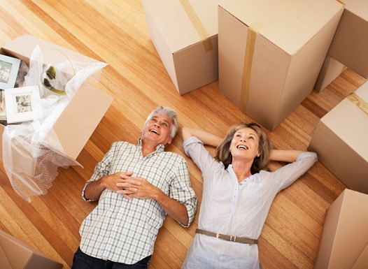 Seniors downsizing with moving boxes