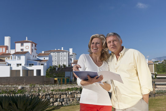 Seniors reviewing retirement information while visiting a retirement community