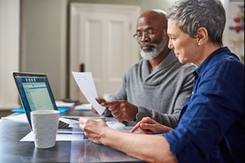 Retired couple working on a laptop