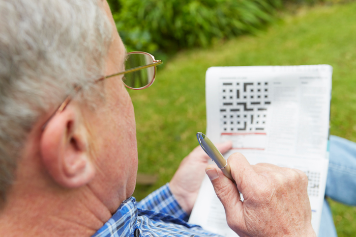 Man doing a crossword puzzle