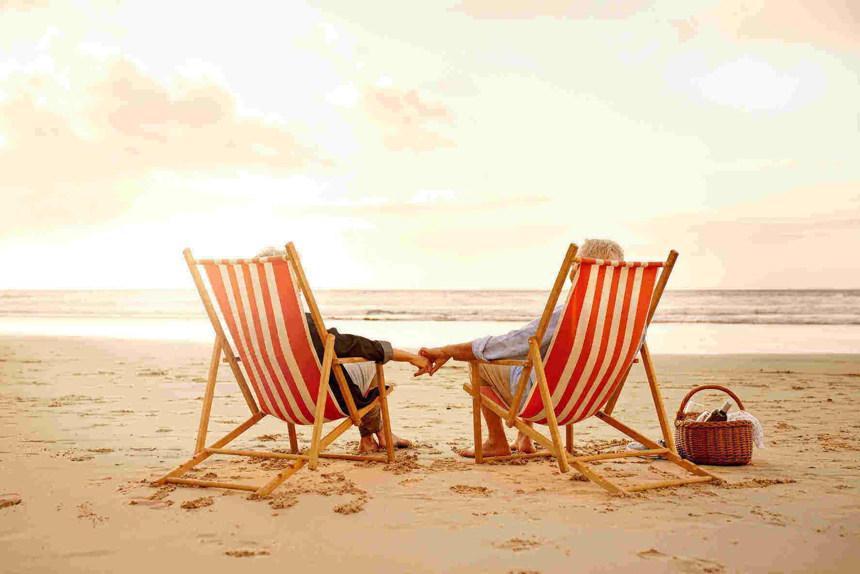 Seniors sitting in chairs on the beach