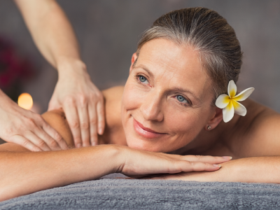 Senior woman receiving massage therapy treatment