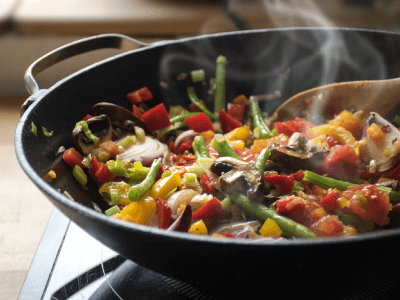 Steaming mixed vegetables in the wok, Asian style cooking