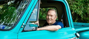 Man in classic car.png